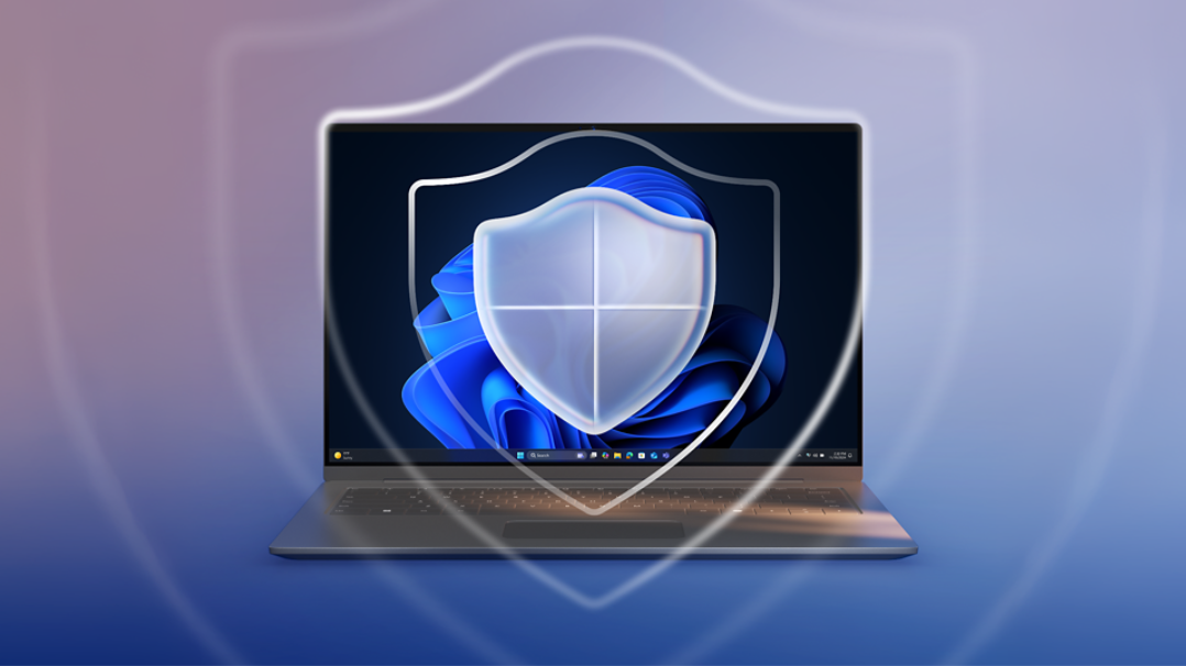 A laptop screen with a blue gradient background and a translucent shield icon symbolizing digital security or protection.