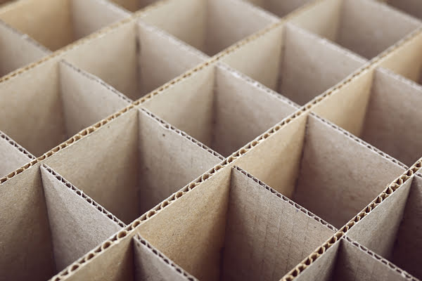 A top down view of brown packaging in a grid