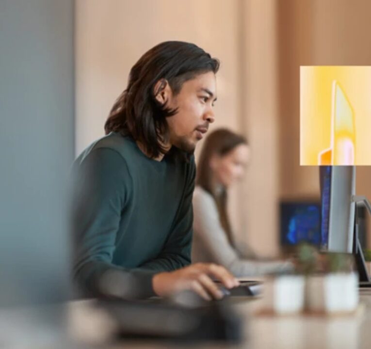 Man working at a computer.
