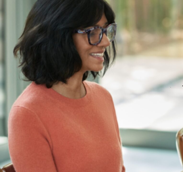Woman sitting at a desk.