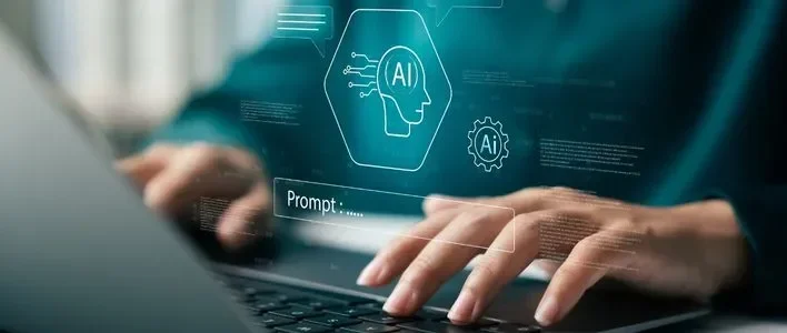 Hands typing on a laptop with GenAI graphics overlay.