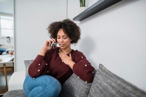 Mum on the phone, looking relieved